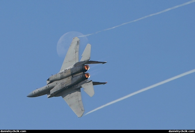 F-15E Eagle making a pass in front of the moon