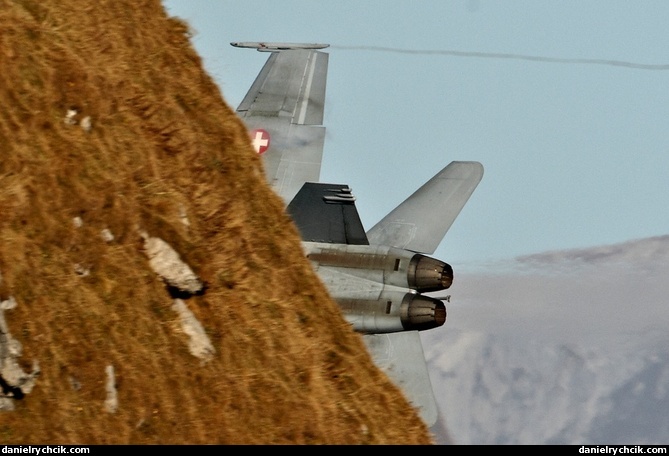 F/A-18C Hornet disappearing behind Axalphorn