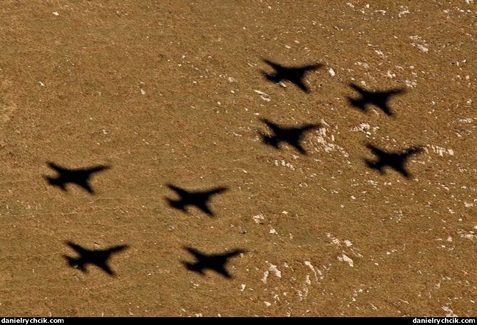 Shadow of the eight F-5E Tiger formation