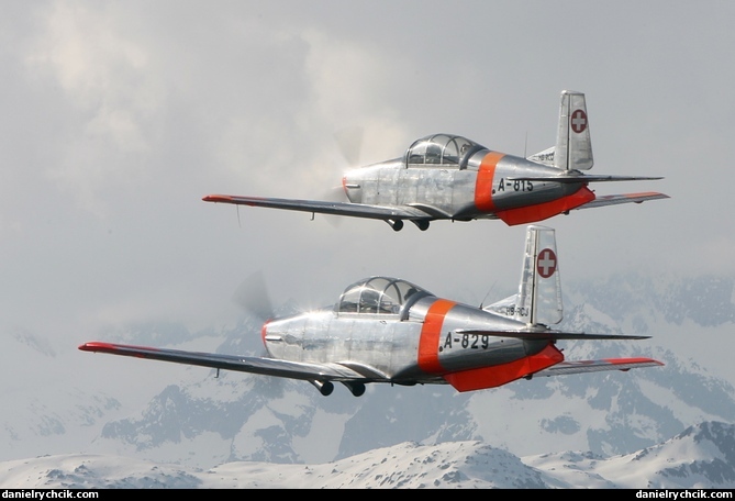 Pair of the Pilatus P-3 over the Swiss mountains