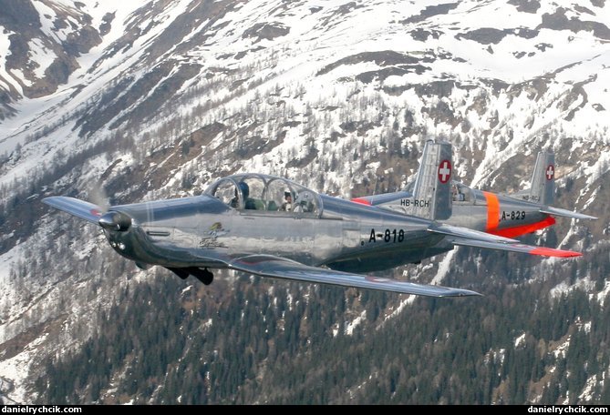 Pair of the Pilatus P-3 over the Swiss mountains