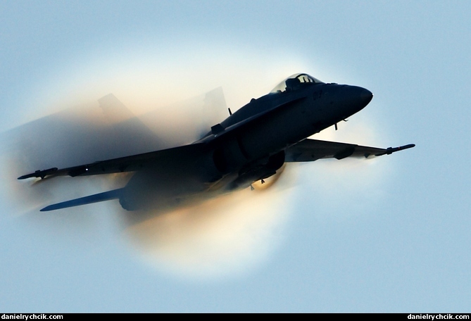 F-18 Hornet getting out of the condensation cloud