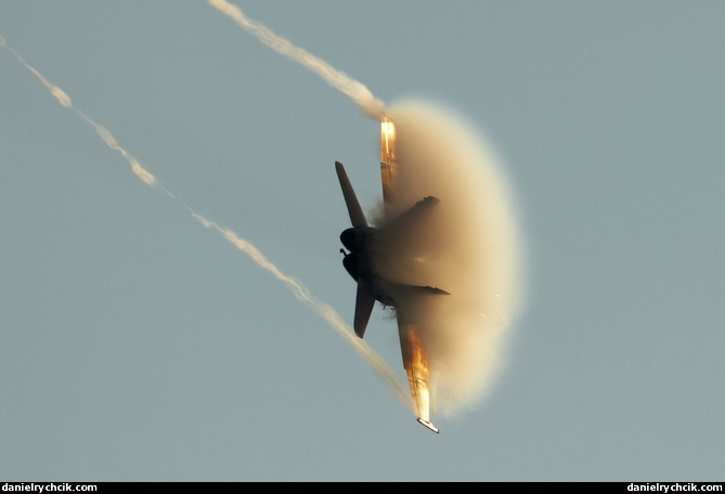 F-18 Hornet in a golden cloud