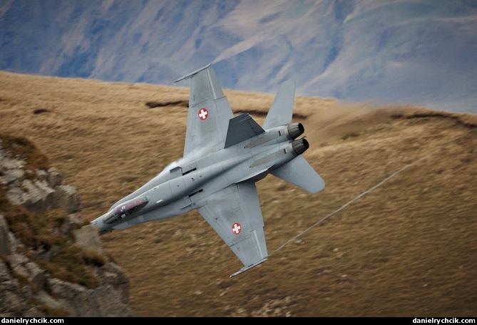 F/A-18C Hornet disappearing behind a mountain