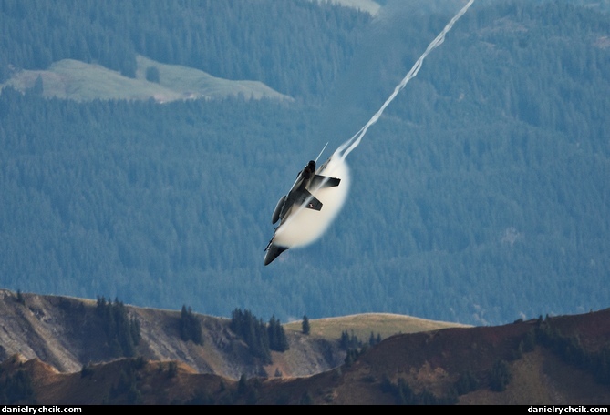 F/A-18C Hornet pulling down with a condensation cloud