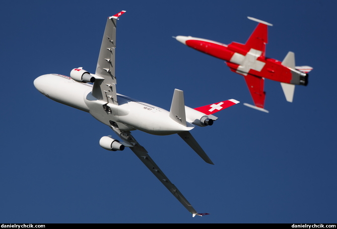 Swis MD-11 and F-5 of Patrouille Suisse in formation