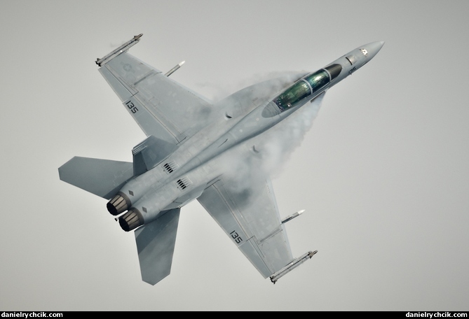 Super Hornet demonstration with condensation clouds